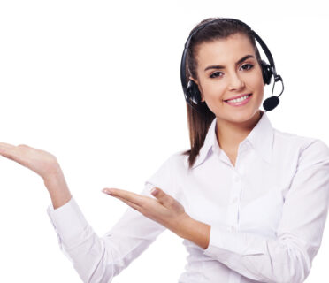 Smiling woman in headset presentation something